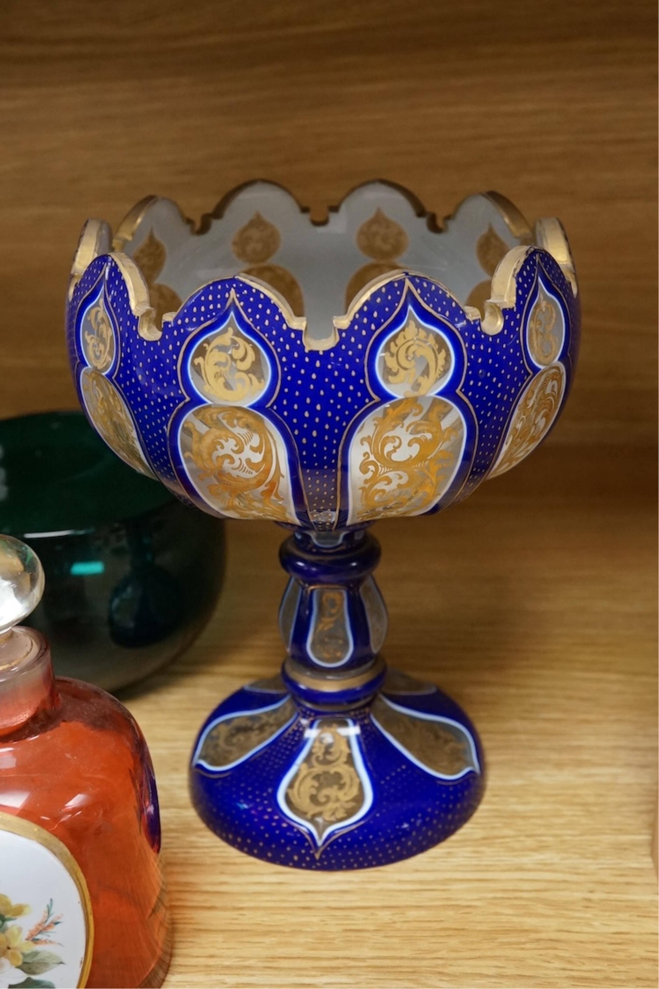 A pair of 19th century green glass fingerbowls, a Bohemian blue overlaid glass vase and a ruby glass scent bottle, largest 20cm high